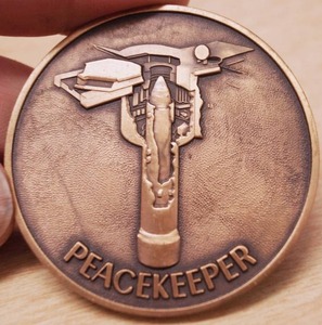 lot 4400 image: Vintage Peacekeeper Coin - Rare Find
