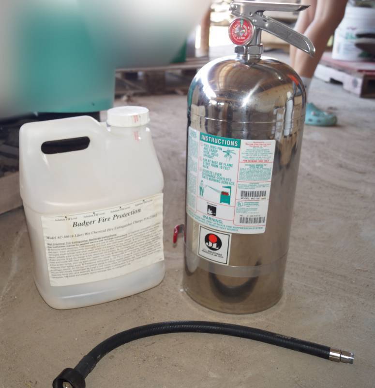 lot 5324 image: Badger Fire Extinguisher M# AC-100 - NIB w sealed Charge Fluid - In original box - For cooking Fires Only