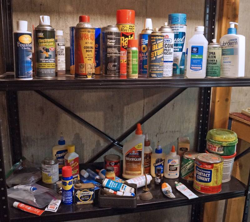 lot 2214 image: Contents on Shelves - Glue, Raid, WD-40, Contact Cement, Car Wax Silicone Spray, Lysol and More - see pics (shelf not included)