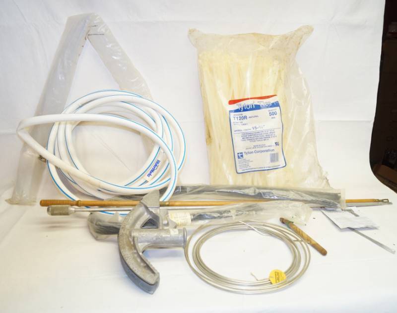 lot 2222 image: Lot of Handy Supplies - Water Hose, 2 Pipe Benders, LARGE 15-14  Zip Ties - Gun Cleaning Rods, Large Roll of Solder - Heat Shrink Wire Insulator and more