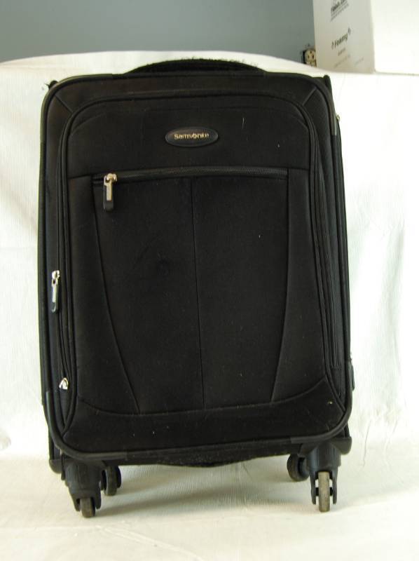lot 4055 image: Rolling Black Suitcase