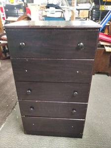 lot 5157 image: Ashley Furniture Merlot Modern 5 Drawer Upright Dresser