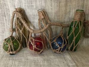 lot 2301 image: Hanging String of Colored bottles and globes