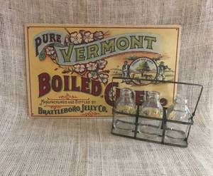 lot 2312 image: Pure Vermont Cider Tin Sign and metal basket with bottles