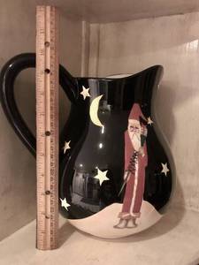 lot 2415 image: Black Ceramic Pitcher with folk art Santa