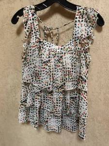 lot 2491 image: Lots of ruffles and polk a dots-sleeveless top