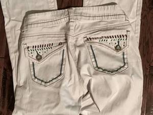 lot 2498 image: White denim jeans with colored stitching and button back pockets