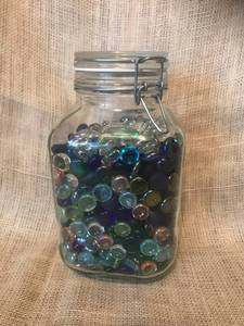 lot 2504 image: Flip Top Glass Jar full of glass colored pieces
