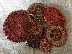 lot 2549 image: Set of Woven Trivets--lots of festive color