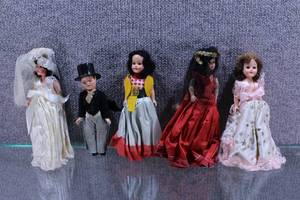 lot 2701 image: Lot of 5 Little Darling Dolls. Bride and Groom, Western, Red and Gold, and Pink with Stars Styled Dresses.