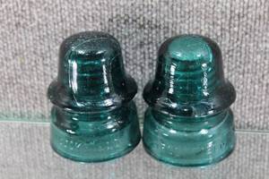 lot 2706 image: Lot of 2 Teal Glass Insulators. Some Chips and Cracks, Shows Wear