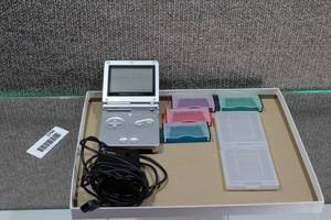 lot 2794 image: Nintendo Gameboy SP with Charger and 4 Game Cases, 2 Gameboy Color Game Cases