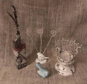 lot 3101 image: Assortment of shelf decor--bicycle bottle, rustic metal candle holder, cast iron bird and bird letter holder