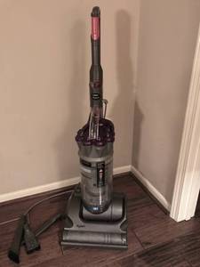 lot 1004 image: Dyson upright used vacuum with attachments--has been cleaned and works