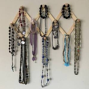 lot 1013 image: Assortment of Necklaces & bracelets (wood wall rack included)