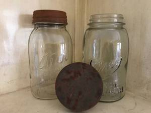 lot 1030 image: Antique Canning Jars and rustic lids