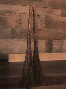 lot 1043 image: Pair of hanging cinnamon brooms