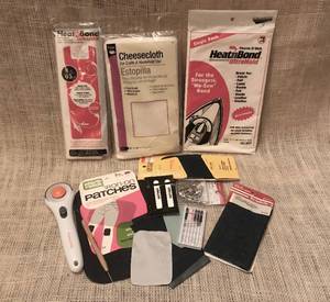 lot 1061 image: Fiskars cutting tool, iron on patches, heat bond and lots of  sewing misc.