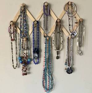 lot 1102 image: Assortment of Necklaces & bracelets (wood wall rack included)