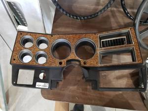 lot 3074 image: 80s GMC Wood Grain Dash Bezel