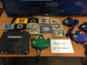 lot 5281 image: Nintendo 64 Console with 4 Controllers and 11 Games