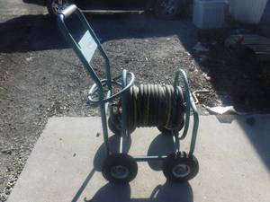 lot 8923 image: Suncast hose reel and hose