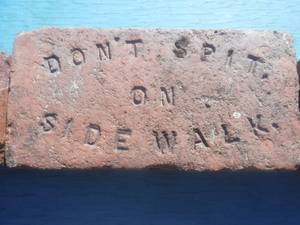 lot 8928 image: Dont spit on sidewalk brick 2 Lawrence Kansas bricks