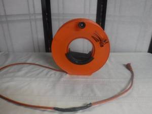 lot 12446 image: Extension cord on a roller, some repairs have been made to the cord
