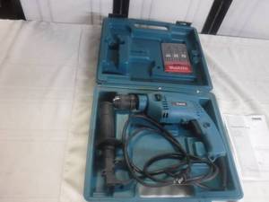 lot 12459 image: Makita hammer drill and extra bits