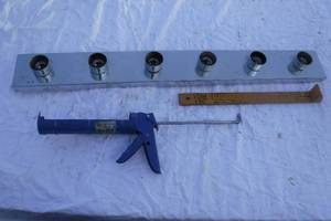 lot 11029 image: Light Fixture Housing, Caulking Gun, and Cobblers Ruler