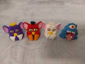 lot 11498 image: Three Furbies and a Monster