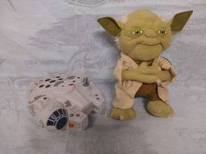 lot 11500 image: Stuffed Yoda and Toy Millennium Falcon