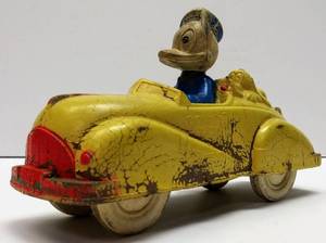 lot 118 image: 1930s Sun Rubber Donald Duck & Pluto Rubber Toy Car