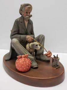 lot 223 image: Norman Rockwell Hungry Hobo  Cooking Dinner With Dog Figurine