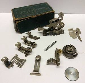 lot 234 image: Vintage Greist Sewing Machine Attachments w Green Box