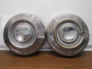 lot 5843 image: 2 Older Cadillac Hub Caps