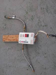 lot 5875 image: Titan SCR2 N-120 220V Electric Tankless Water Heater