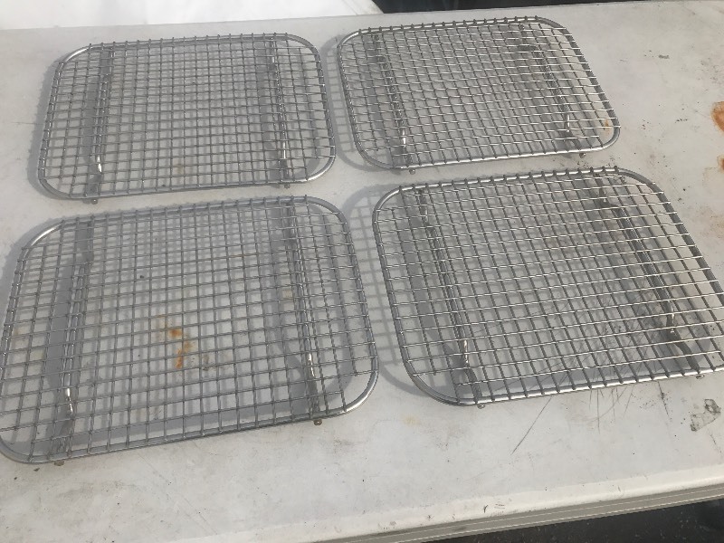 lot 105 image: Lot of four heavy duty stainless steel cooling racks or use for hot plates many uses