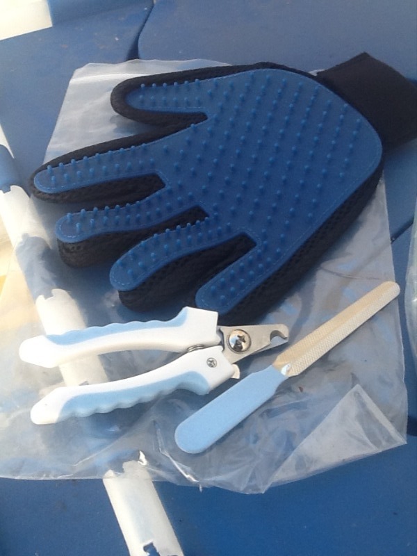 lot 112 image: Great stocking stuffers pet grooming kit with brush glove toenail trim and file you get two sets
