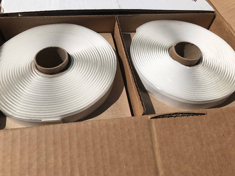 lot 17 image: Three rolls of putty style sealant 18by 12 by 25 foot each roll great for RV repairs window sealant  roof vent sealant siding use your imagination