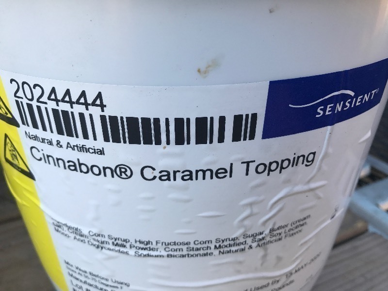 lot 338 image: 20 pound bucket of Cinnabon caramel frosting for cinnamon rolls or whatever make your own sticky buns with the Cinnabon caramel sauce best used date 2020