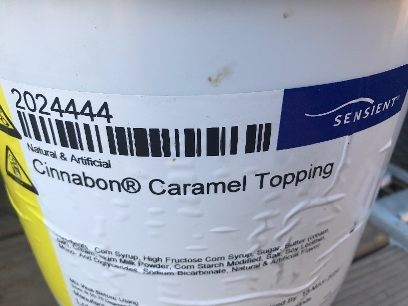 lot 340 image: 20 pound bucket of Cinnabon caramel frosting for cinnamon rolls or whatever make your own sticky buns with the Cinnabon caramel sauce best used date 2020