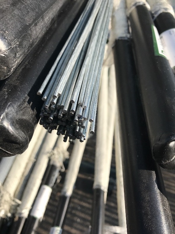 lot 598 image: Bundle of (100) 10 foot pieces of wire its called ceiling grid wire but can be used for many many things galvanized use your imagination retails for $160