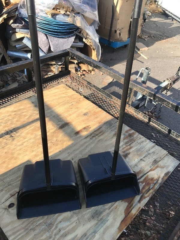 lot 616 image: Two new dust pans with handles flips up when you pick it up lays down flat for loading