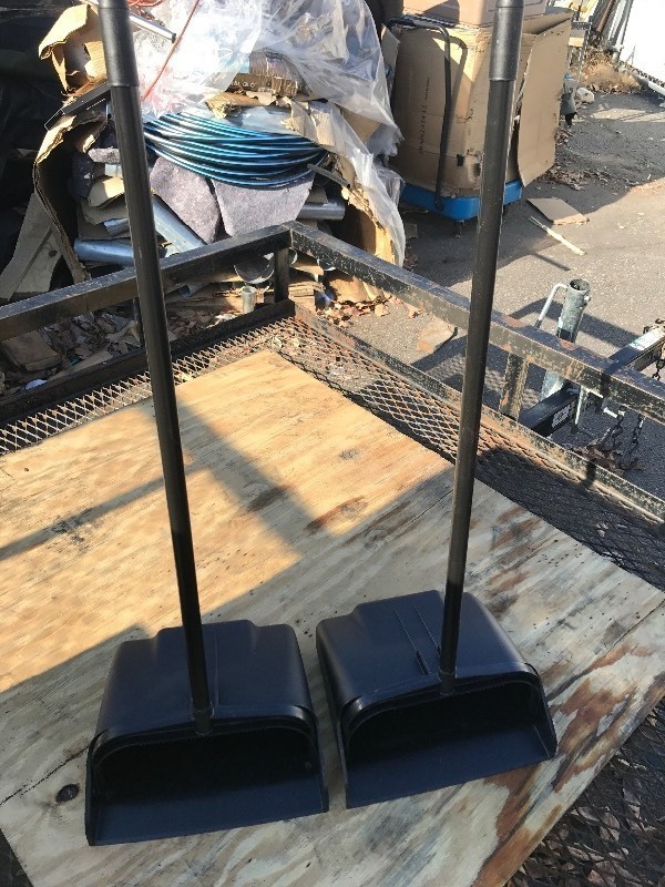 lot 620 image: Two new dust pans with handles flips up when you pick it up lays down flat for loading
