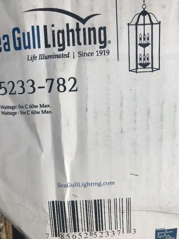 lot 633 image: High  Dollar entryway chandelier Glass panel broken in shipping 4 x 20 can be replaced at hardware store no special glass window pain