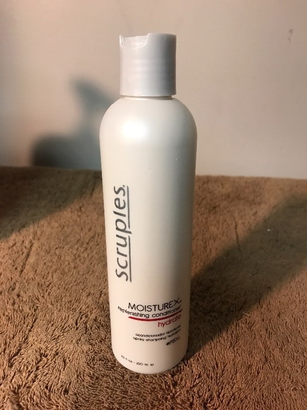 lot 686 image: Four bottles of high dollar hair care conditioner replenishing