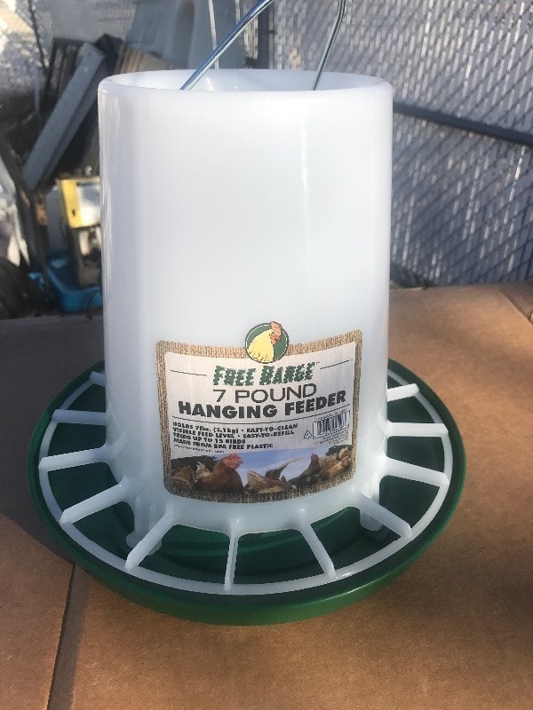 lot 71412 image: New 7 pound chicken feeder as pictured great for your new chicken coop in your backyard