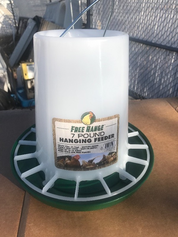 lot 71413 image: New 7 pound chicken feeder as pictured great for your new chicken coop in your backyard