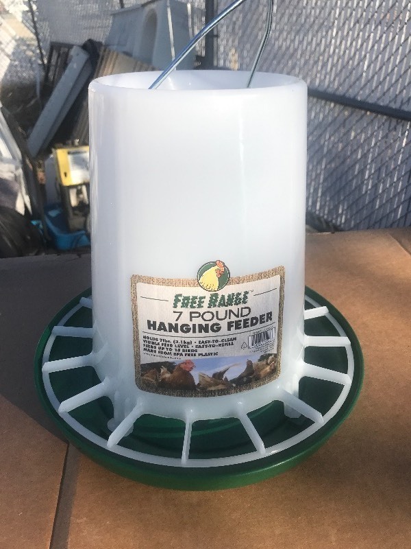 lot 80000 image: New 7 pound chicken feeder as pictured great for your new chicken coop in your backyard